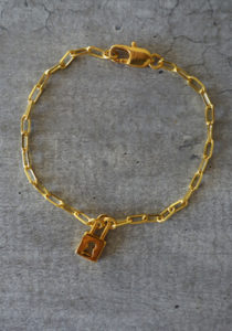 gold padlock and large links chain bracelet