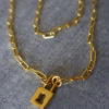 SITE SECRET 3 gold padlock and large link chain