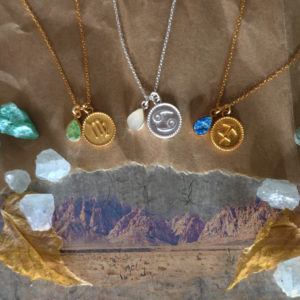Zodiac medals with raw crystals